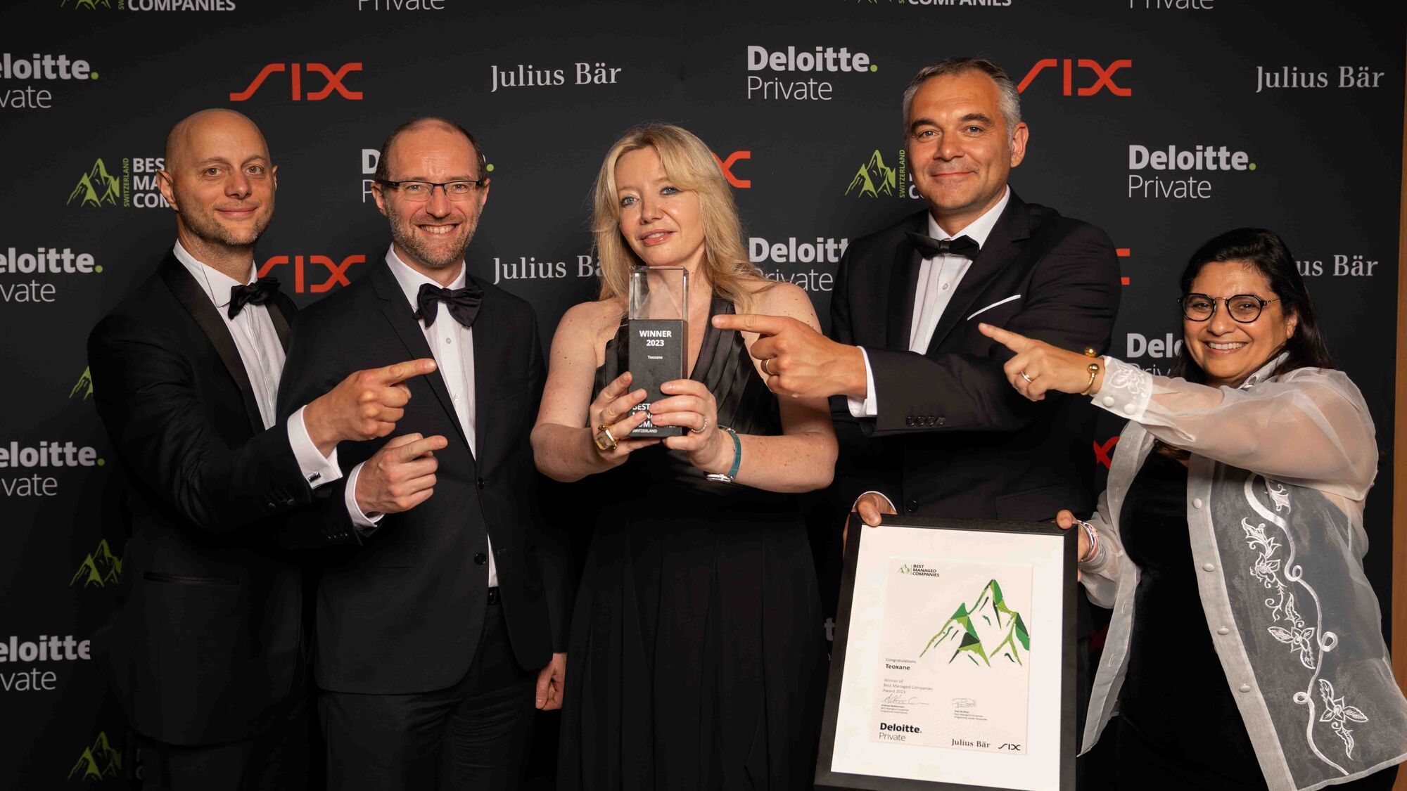 BMC Teoxane Team holding the trophy